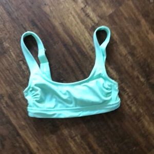 Teal bathing suit top with pastel pink on back